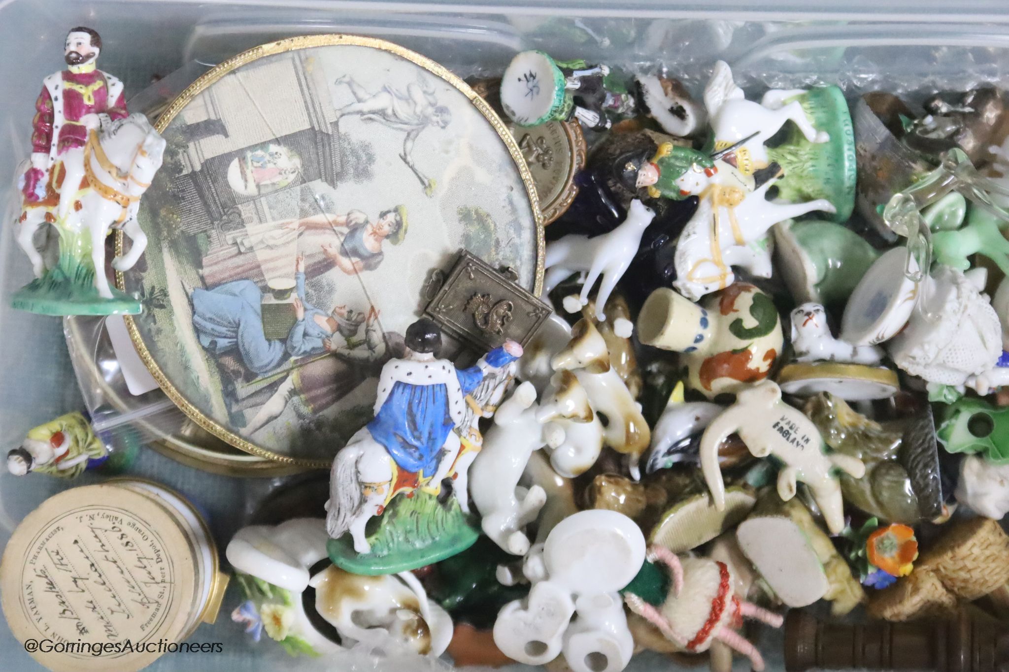 A collection of miniature ceramic and glass figures and animals, treen, enamel patch boxes, souvenirs and curios